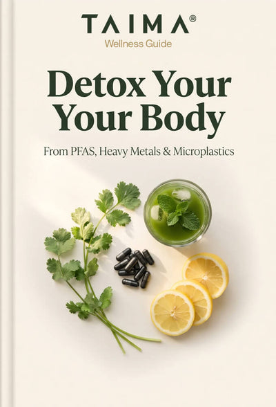 Book cover for 'Detox Your Your Body' wellness guide by TAIMA, featuring a clean cream background with dark green typography and a styled flat-lay of mint, cilantro, black capsules, and lemon slices.