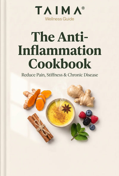 Front cover of the book 'The Anti-Inflammation Cookbook' by TAIMA Wellness Guide, featuring a cream background with dark green text and an illustration of wellness ingredients including turmeric, ginger, cinnamon, star anise, blueberries, and mint.